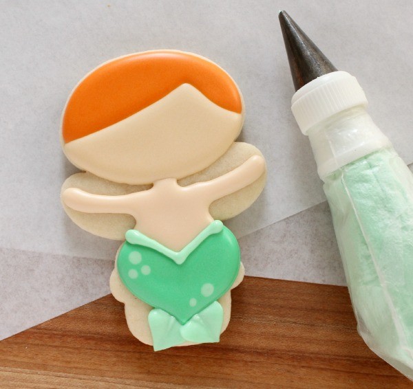How to Make Mermaid Cookies with a Wilton snowman cutter via Sweetsugarbelle blog